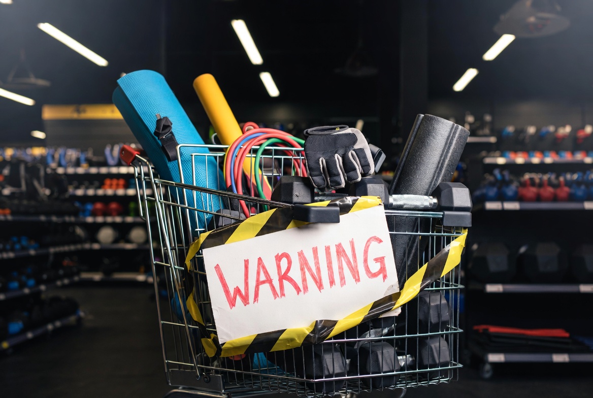 Shopping cart with exercise gear and warning overlay